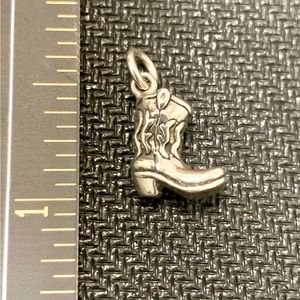 Sterling silver cowgirl boot charm.